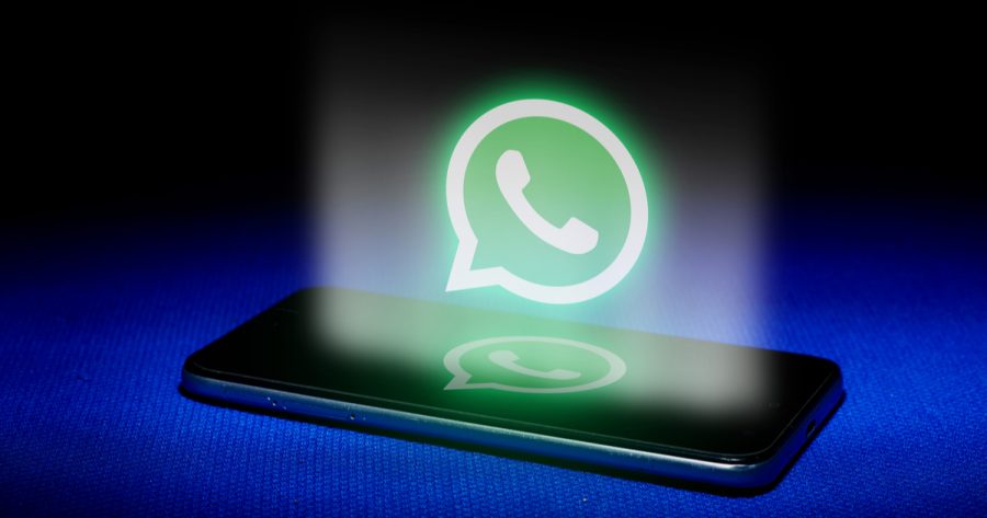 Hologram of whatsapp logo. hologram whatsapp logo image on blue background . The concept of next technology,social media